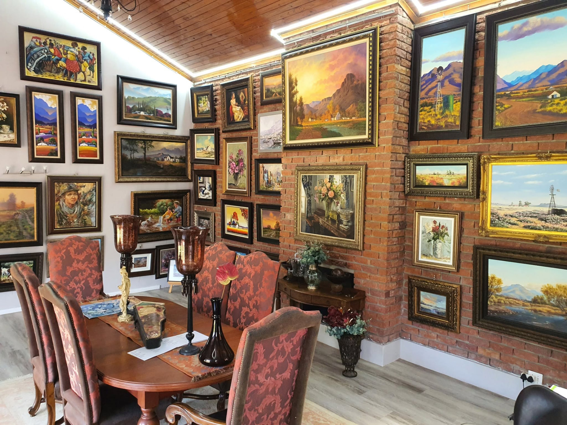 Inside Kunssinnig Gallery in Durbanville, Cape Town — walls hung with South African paintings